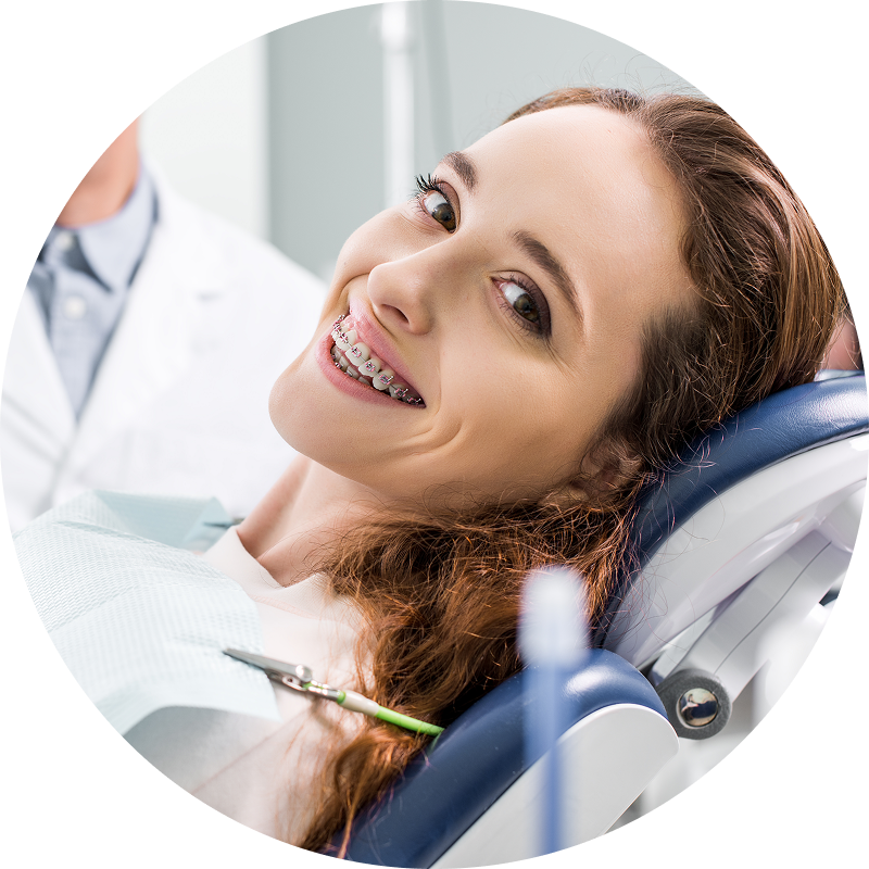 woman in chair with braces